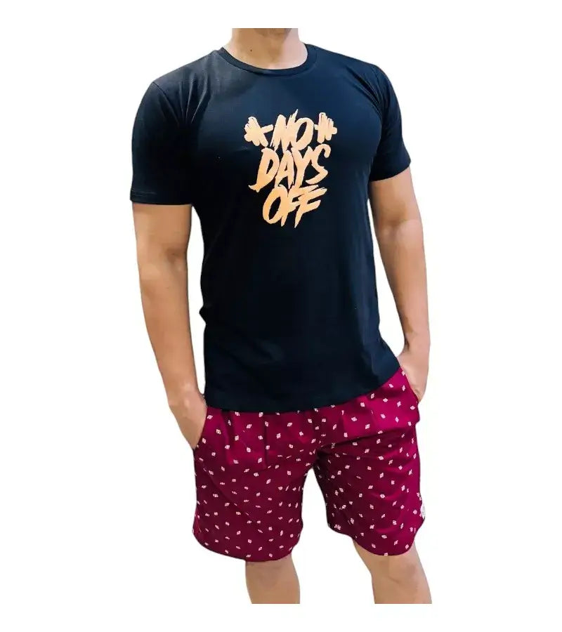 Men's black t-shirt with 'NO DAYS OFF' graphic, paired with stylish red polka dot shorts for a casual look.