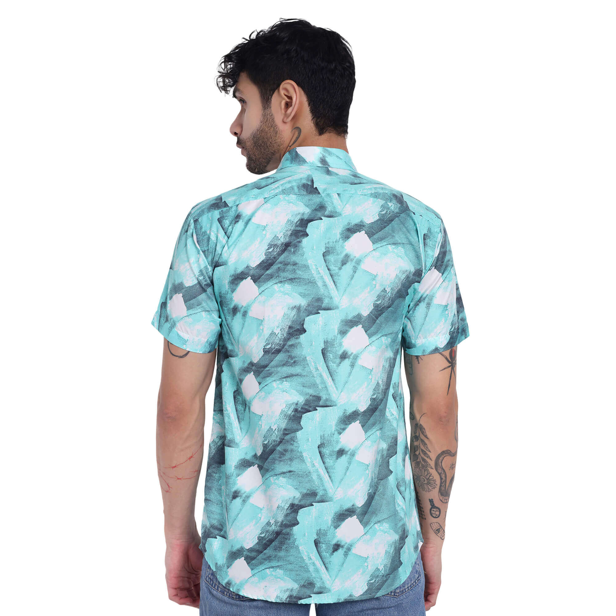 Back view of a man wearing a trendy check print short sleeve shirt in teal and white.