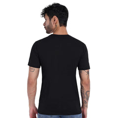 Back view of a man wearing a black 100% cotton T-shirt, showcasing comfort and style.