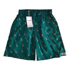 Men's green boxer shorts with floral pattern, featuring an elastic waistband and tags, stylish and comfortable for everyday wear.