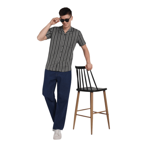 Full outfit – men’s half-check jute shirt paired with casual pants standing 
